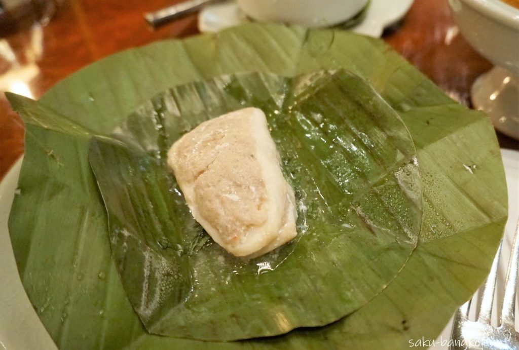 Steamed snow fish, northern style crab paste fresh herbs in banana leaves